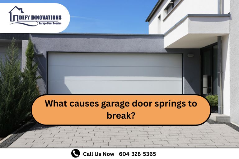 What causes garage door springs to break?
